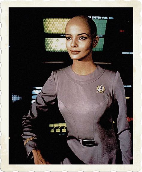 A Woman In A Star Trek Uniform Posing For A Photo