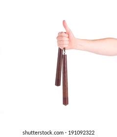 Hand Holding Nunchaku Weapon Isolated On Stock Photo