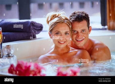 An Attractive Couple In A Resort Hot Tub Stock Photo Alamy