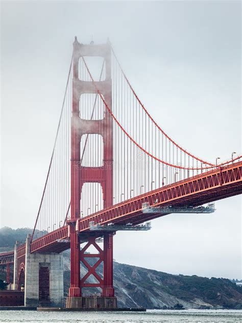 Golden Gate Bridge Covered By Fog At Overcast Sunrise Stock Photo