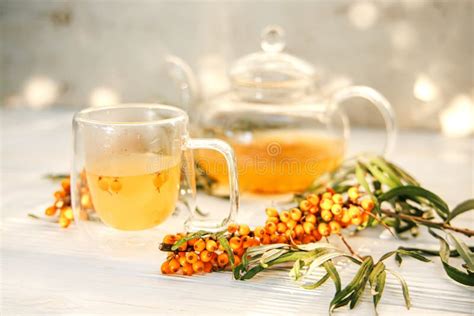 Sea Buckthorn Infused Tea Served In A Crystal Clear Cup And Teapot