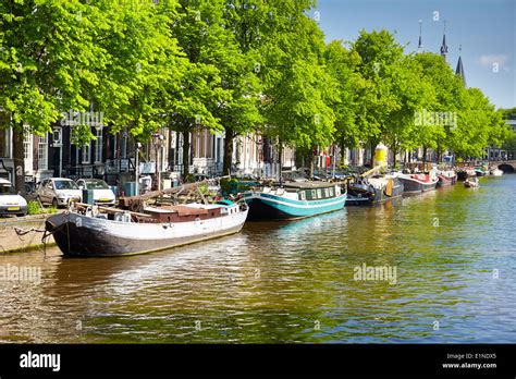 Houseboat barge, Amsterdam canal - Holland Netherlands Stock Photo - Alamy