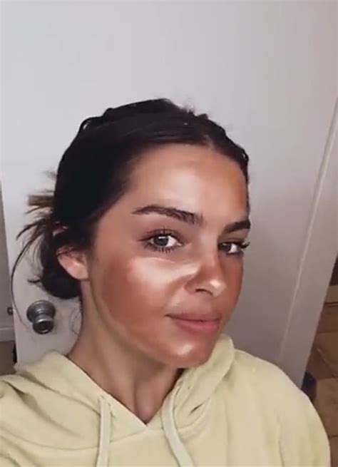 A Woman With Makeup On Her Face Is Taking A Selfie In Front Of The Camera