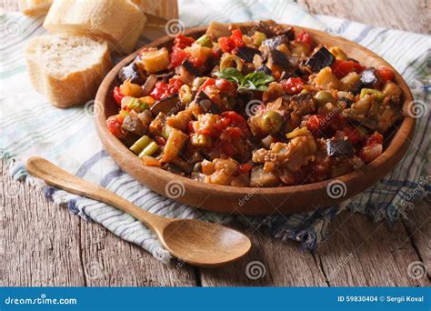 Italian Appetizer Caponata Close-up on a Wooden Plate. Horizonta Stock ...