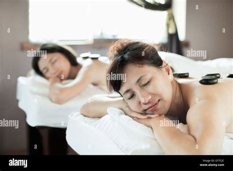 Mother And Daughter Having Hot Stone Massage Together Stock Photo Alamy