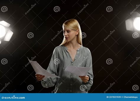 Professional Actress Reading Her Script During Rehearsal In Theatre