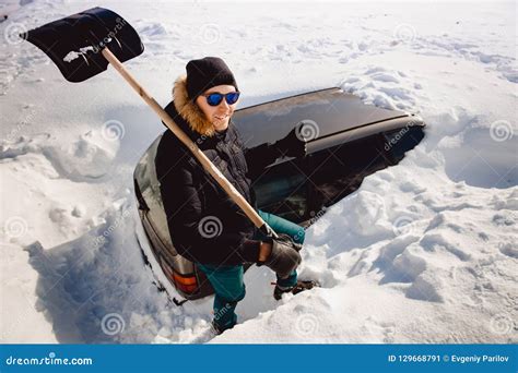 Man Cleans Snow And Cleans Car Shovel From Snow Stock Image Image Of