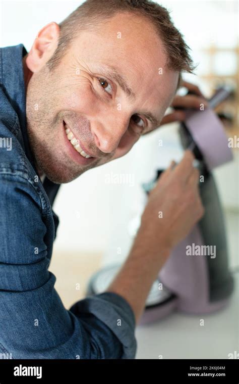 Serious Man Repairing Broken Coffee Machine Stock Photo Alamy