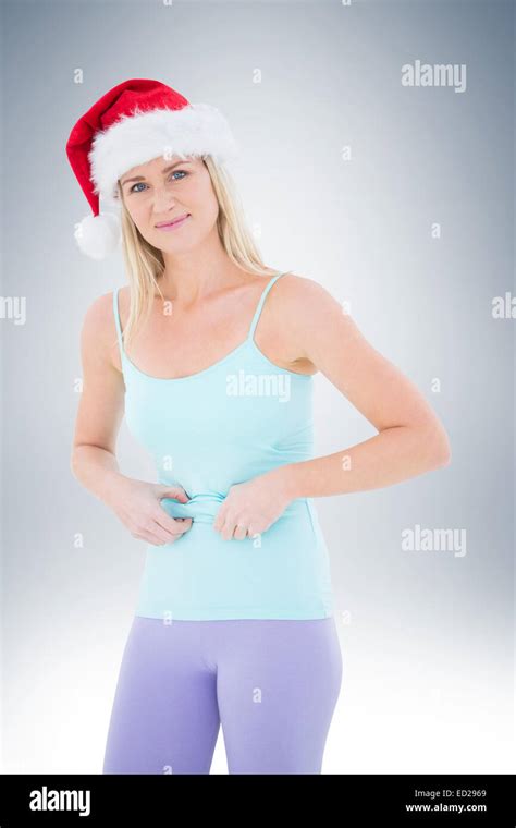 Festive Fit Blonde Pinching Her Stomach Stock Photo Alamy