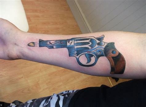 traditional revolver tattoo by LianjMc