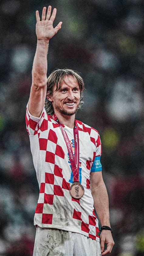 Luka modric of croatia holds the award best player of the tournament ...