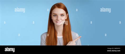 Attractive Modest Good Looking Redhead Girlfriend Acting Mature Friendly Smiling Pointing Left