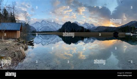 Reflections Of A Sunset Over Alpine Mountain Lake Almsee In Austria