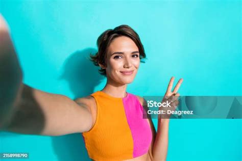 Photo Of Cheerful Positive Lady Dressed Colorful Top Showing Vsign