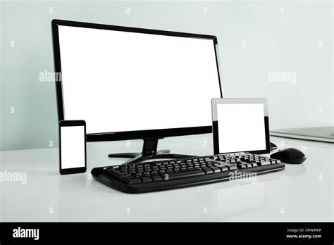 Computer Desktop With Digital Tablet And Mobilephone On Desk Stock ...
