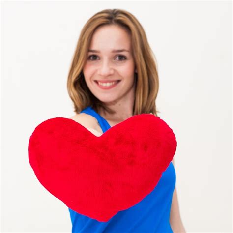 Premium Photo Beautiful Woman With Heart Shape Pillow Against White