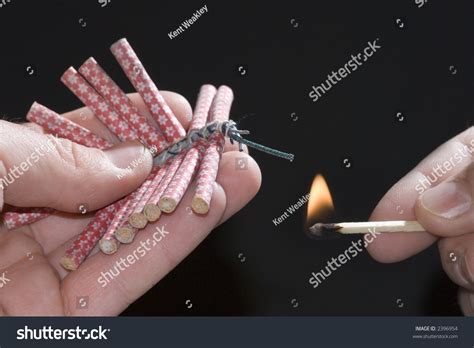 Fireworks Lit With Flame Of Match 06 Stock Photo 2396954 : Shutterstock