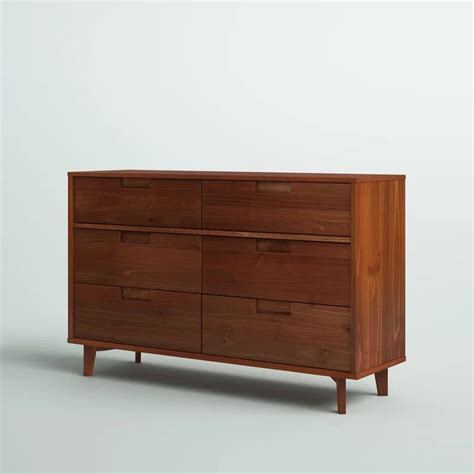 A Large Wooden Dresser Sitting On Top Of A White Floor