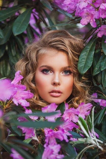 Premium Photo Portrait Of A Young Beautiful Girl In Flowers