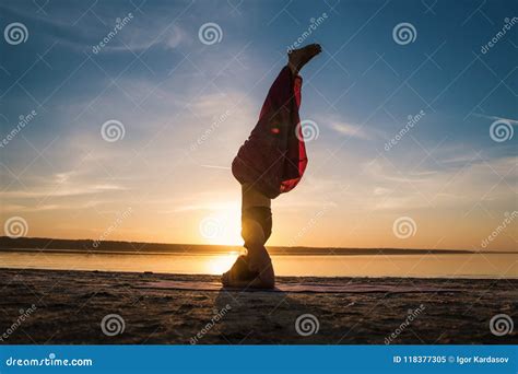 Silhouette Yoga Woman on the Beach at Sunset. Stock Image - Image of ...