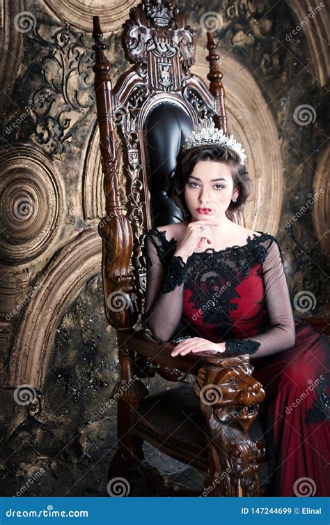 Queen In Red Dress Sitting On Throne Symbol Of Power And Wealth