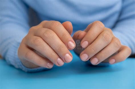Stylish Nude Beige Female Nails On Blue Background Modern Trendy Stylish Beautiful Manicure