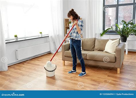 Woman Or Housewife With Mop Cleaning Floor At Home Stock Photo Image