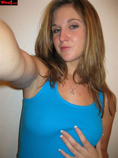 Desirable Brunette Girl Posing In Black Lingerie On The Couch Photos