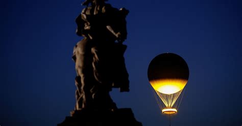 In pictures: Olympic cauldron dazzles above Paris each night - August 5 ...