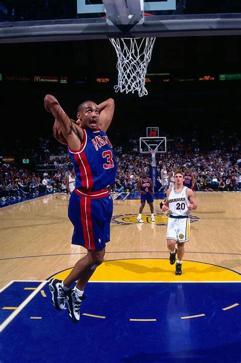 a basketball player dunking the ball into the hoop