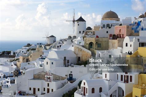 White Traditional Greek Houses On A Hillside On The Island Of Santorini