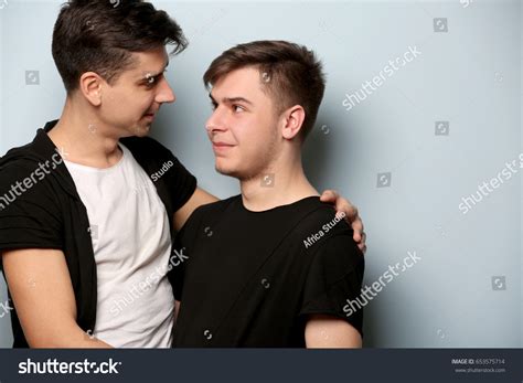Happy Gay Couple Posing On Light Stock Photo 653575714 Shutterstock