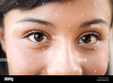 Closeup Of Fifteen Year Old Hispanic Teenager Looking At Camera Girl Woman Latina Latino