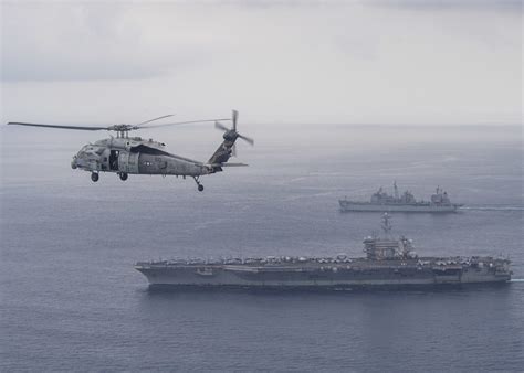 An Mh S Sea Hawk Flies Above Uss Theodore Roosevelt And Flickr