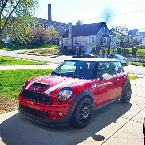 Red and White Mini Cooper Parked on the Side of the Road