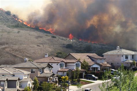 Southern California brush fire near houses | Construction Bonds, Inc.