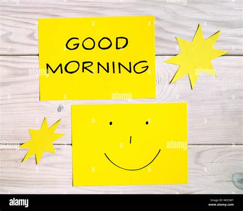 Text good morning and smiley face with sun shapes on wooden table Stock ...