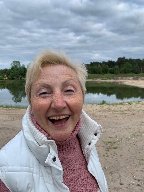 Premium Photo Portrait Of Smiling Mature Woman Outdoors