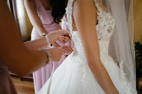 Free Photo Morning Of The Bride When She Wears A Beautiful Dress