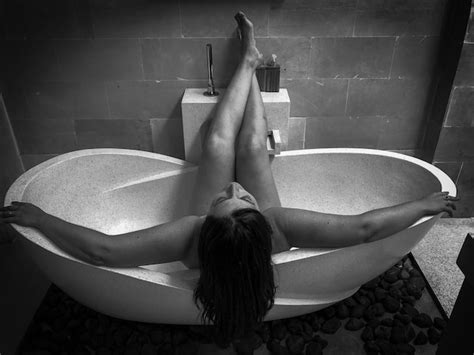 Premium Photo High Angle View Of Naked Woman Sitting In Bathtub