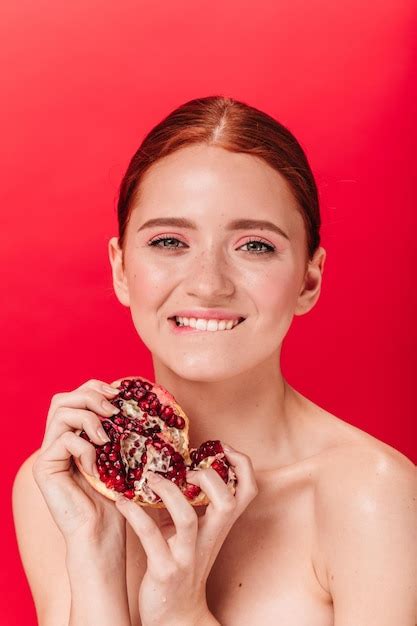 Premium Photo Inspired Ginger Girl Holding Ripe Pomegranate Front