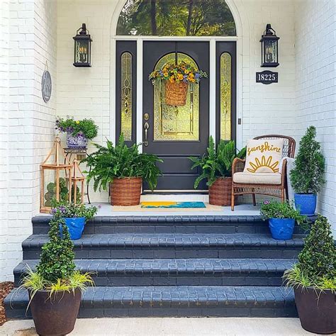 Yellow And Blue Flowers On A Grey Front Door With Sidelights And A