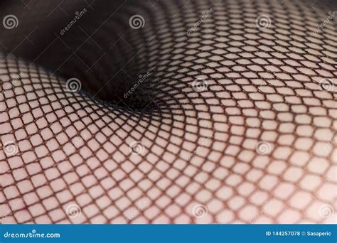 Close Up Of Female Legs In Black Fishnet Stockings Stock Photo Image Of Curves Lingerie