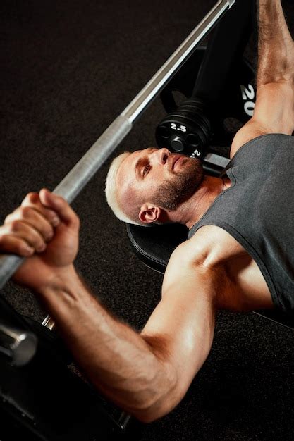 Premium Photo Closeup Portrait Of A Muscular Man Workout With Barbell