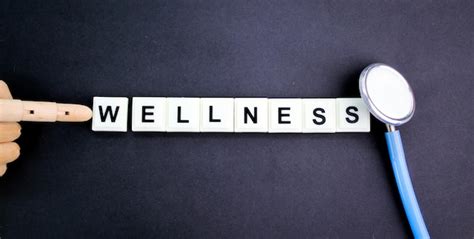 Premium Photo Stethoscope And Alphabet Letters With The Word Wellness