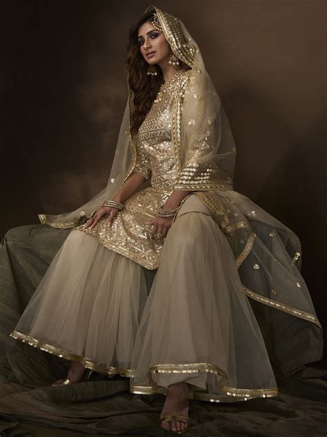 Dusky Beige Soft Net Sharara Suit With Sequin Work And Soft Net Dupatta