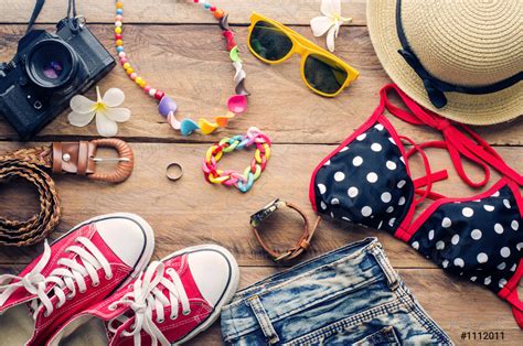 Beauty Colorful Bikini And Accessories On Wooden Floor Stock Photo