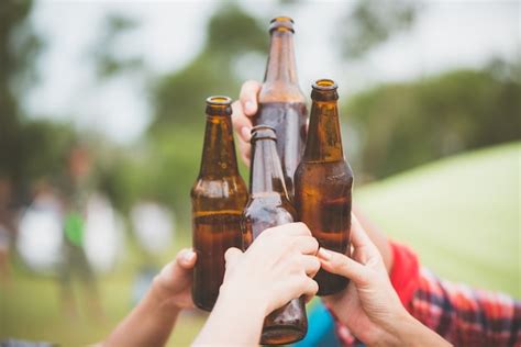 Premium Photo Bottles Of Beer Group Of Friends Enjoying Party People