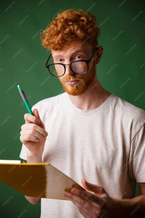 Free Photo Smart Readhead Bearded Man In White Tshirt Holding Folder