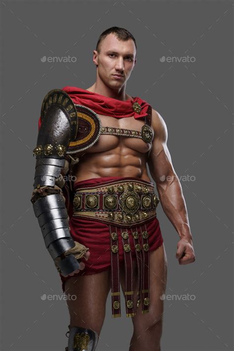 Roman Gladiator Champion With Red Cape Against Grey Background Stock